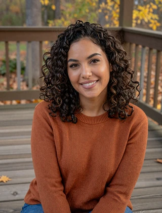 Sample profile card - Maya, 29, smiling on an autumn porch for MilaDate review illustration